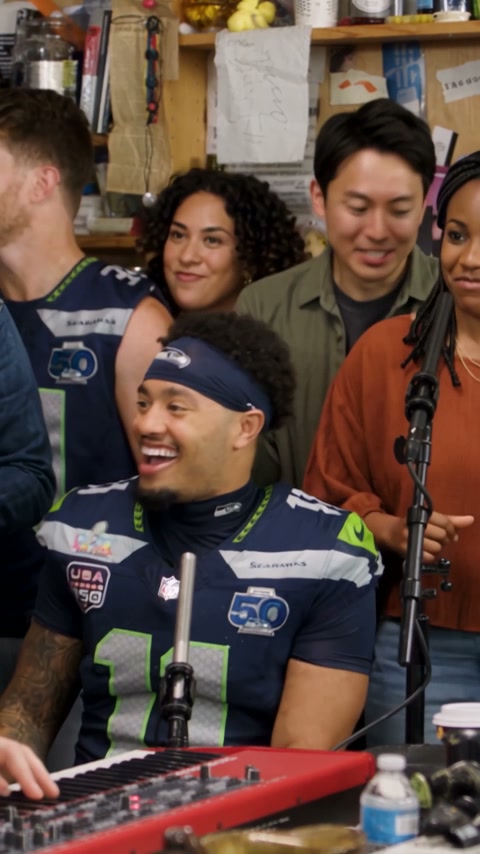 Audience packed around the desk during the 2023 Tiny Desk performance that started the meme
